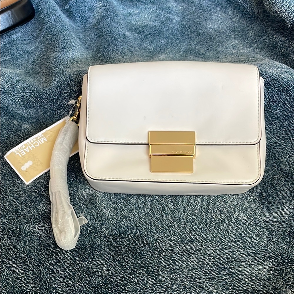 Michael Kors White wristlet.